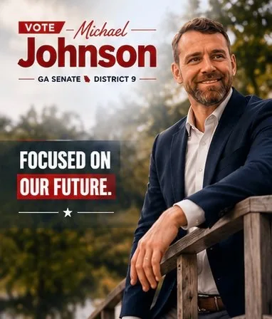Michael Johnson smiling outdoors at a Gwinnett County community event